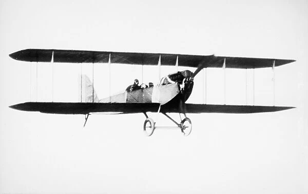 A Tractor biplane in flight. Photograph, 1914