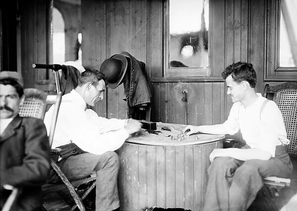 TUBERCULOSIS PATIENTS. Men infected with tuberculosis playing dominoes on board