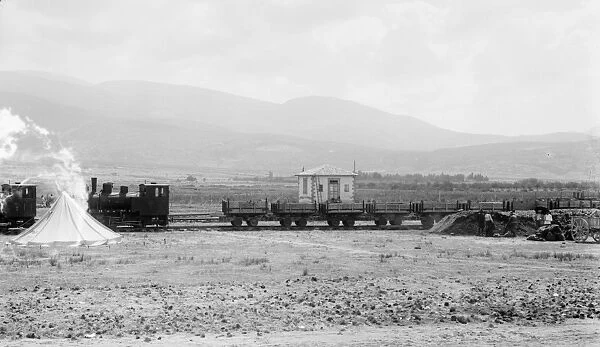 TURKEY: RAILROAD. Two locomotives pulling open cars on the railraod at Alexandretta