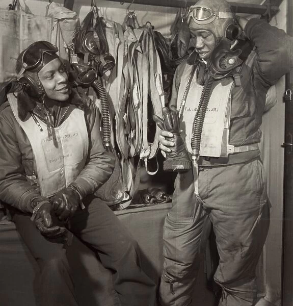 TUSKEGEE AIRMEN, 1945. William Campbell (left) and Thurston Gaines, Jr. of the Tuskegee Airmen 332nd Fighter Group at Ramitelli Airfield, Italy, March 1945. Photograph by Toni Frissell