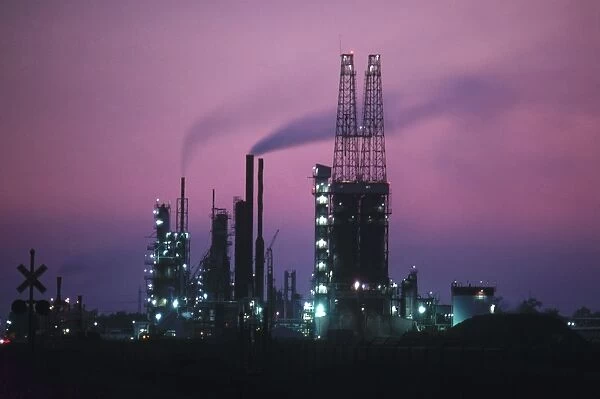 Twilight view of a refinery in St. Louis, Missouri. Photographed c1974