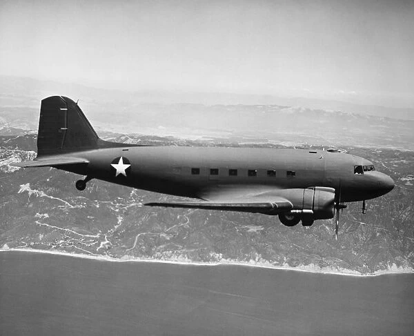U. S. Air Force Douglas Skytrain C-47 (military cargo version of DC-3) in flight, location unknown, c1944, during World War II