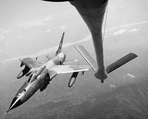 A U. S. Air Force F-105 Thunderchief supersonic fighter-bomber in flight over Vietnam, 1967