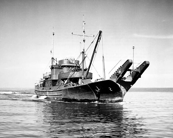 U. S. Navy ship used for laying steel anti-torpedo nets, which were placed at the mouths of harbors or around ships at anchor. Photographed March 1944