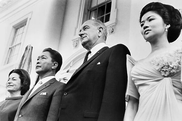 U. S. President Lyndon Johnson (center) with President Ferdinand Marcos of the Philippines and their wives, Lady Bird Johnson (left) and Imelda Marcos, at the White House in Washington, D. C. 14 September 1966. Photographed by Marion S. Trikosko