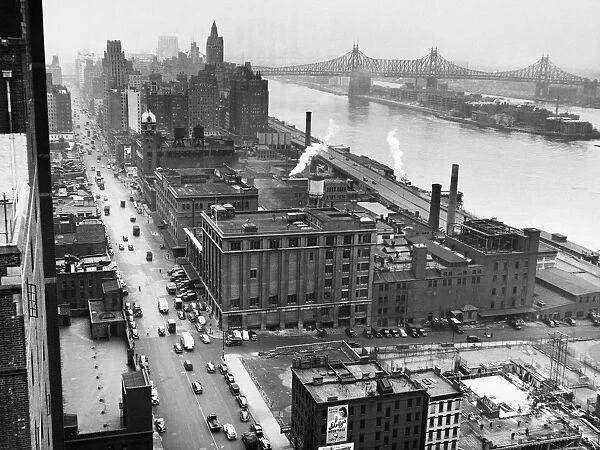 UNITED NATIONS: SITE, 1946. Looking north along First Avenue from Tudor City at 41st Street, on the site of the future headquarters of the United Nations, December 1946. The Queensborough Bridge is in the background