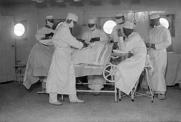 USS COMFORT, c1919. The operating room aboard the hospital ship USS Comfort. Photograph