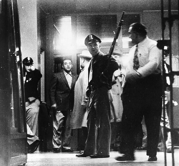 UTAH STATE PRISON RIOT. Armed prison officials at the Utah State Prison during an inmate riot, early 1950s