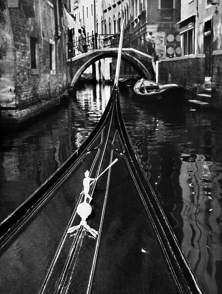VENICE: CANAL, 1969. Bow of a gondola on a canal in Venice, Italy, 1969