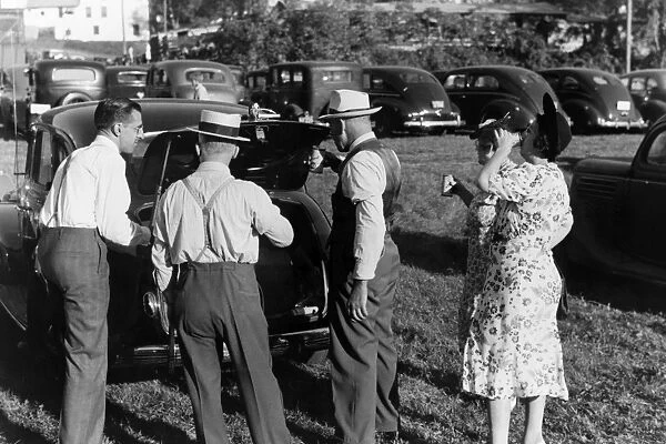 VERMONT STATE FAIR, 1941. Three men and two women drinking beer in the parking