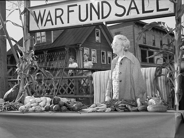 VICTORY STORE, 1942. Mrs. Alice White selling donated produce for the war fund in Hardwick