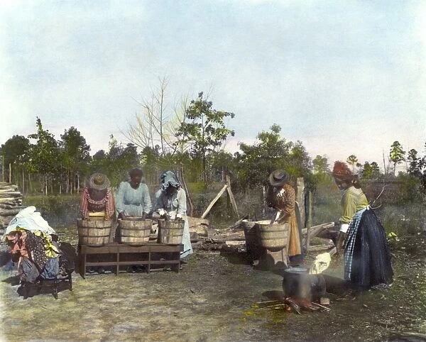 VIRGINIA: WASH DAY, 1900. African American women and girls washing the family laundry, Virginia