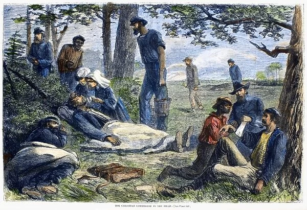 Volunteers of the Christian Commission give first aid to wounded Union soldiers at a battlefield during the American Civil War. Wood engraving, American, 1864