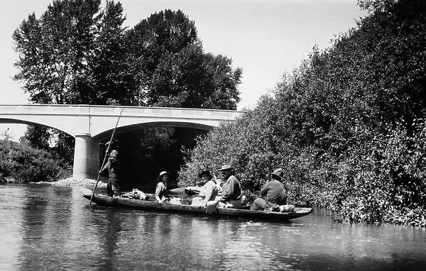 WASHINGTON: CANOE, 1921. Duwamish Native Americans transporting passengers in a