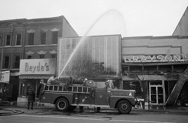 WASHINGTON: RIOTS, 1968. Firemen hosing down buildings that were burned during