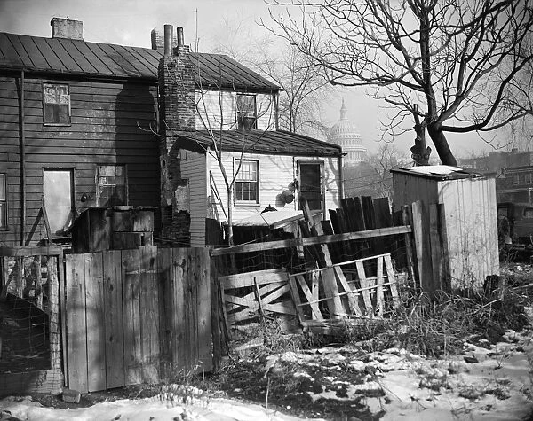 WASHINGTON SLUM, 1938. Houses that were torn down after President Roosevelt approved the $15