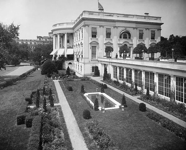 WHITE HOUSE, 1914. View of the east garden, colonnade and the White House, Washington, D