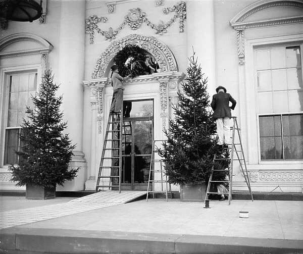WHITE HOUSE: CHRISTMAS, 1939. Workers decorating the White House with Christmas trees