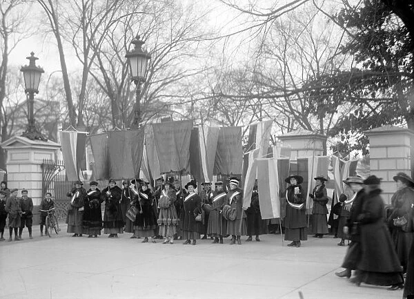 WHITE HOUSE: SUFFRAGETTES. Women suffragettes picketing in front of the White House