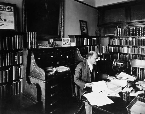 WILLIAM E. B. DU BOIS (1868-1963). American educator, editor and writer. Photographed in his study
