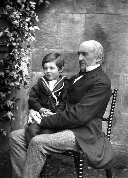 WILLIAM EWART GLADSTONE (1809-1898). English statesman. Photographed with his grandson