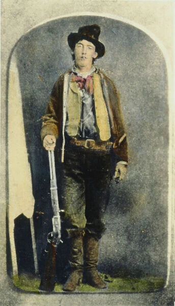 WILLIAM H. BONNEY (1859-1881). Known as Billy the Kid. American desperado. Billy the Kid holding a Model Winchester 73 rifle. Oil over a photograph, c1880