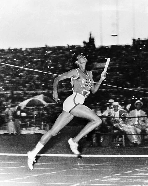 WILMA RUDOLPH (1940-1994). American track and field athlete. Crossing the finish line to win the 400-meter relay for the United States at the Summer Olympic Games in Rome, Italy, 8 September 1960
