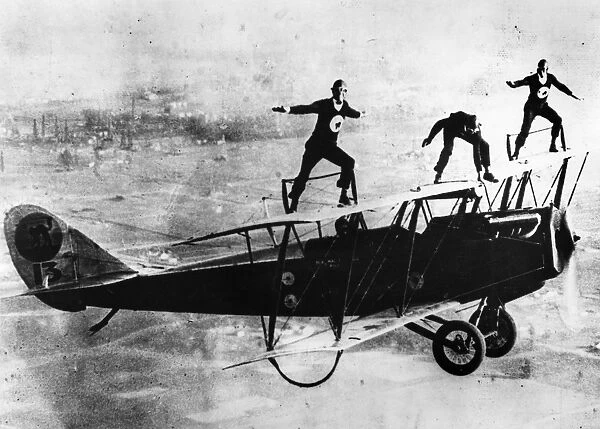 WING WALKING, c1925. Left to right: Spider Matlock, Al Johnson and Fronty Nichols