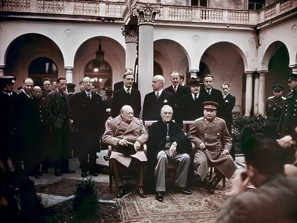 Winston Churchill, Franklin D. Roosevelt and Joseph Stalin at the Yalta Conference at Livadia Palace, Yalta, Crimea. Standing left to right: Anthony Eden, Edward Stettinius, Alexander Cadogan, Vyacheslav Molotov and W. Averell Harriman. Photograph, February 1945