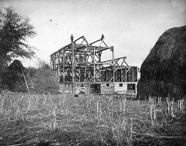 WISCONSIN: BARN, c1900. Men on the rafters of an unfinished barn in Black River Falls, Wisconsin