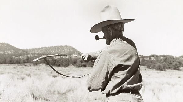 WELL WITCHING, 1940. A cowboy searching for water with a forked stick (dowsing