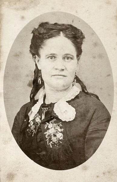 WOMAN, c1880. Portrait of a woman. Carte de visite from a photography studio in Chicago