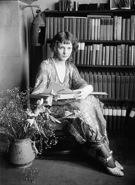 WOMAN, c1920. Portrait of a woman reading. Photograph, c1920
