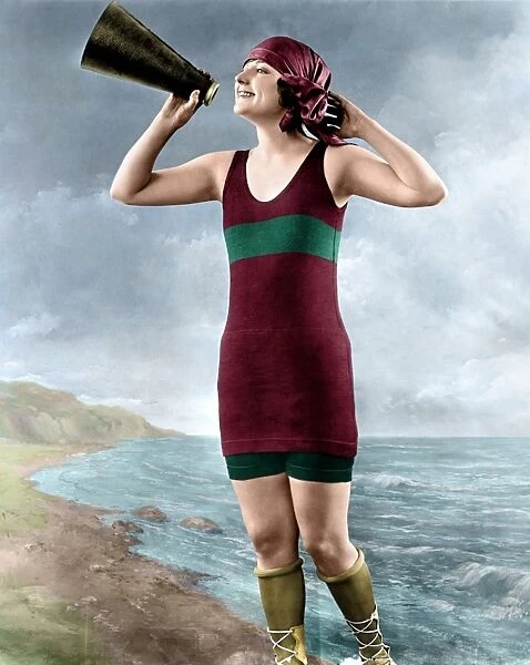 WOMAN, c1920. A woman holding a megaphone. Photograph, c1920, digitally colored by Granger