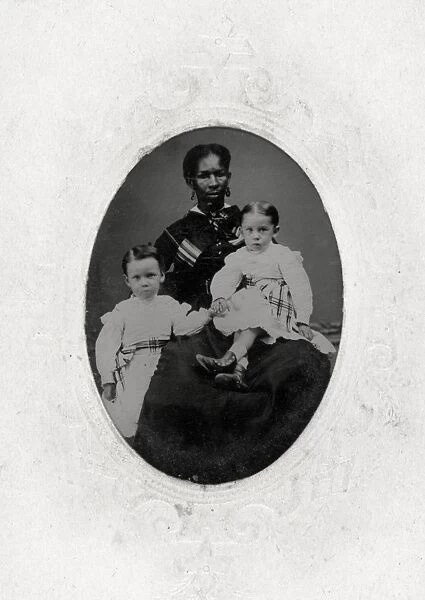 WOMAN AND CHILDREN, c1865. Portrait of an African-American woman, probably a nanny