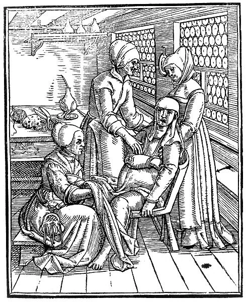 A woman giving birth with the aid of midwives and an obstetrical chair. Woodcut bu Jacob Rueff, 1554