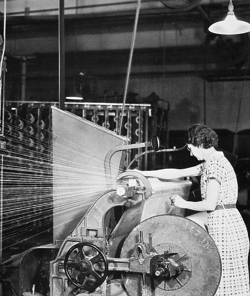 WOMAN TEXTILE WORKER, 1937. Photographed by Lewis W. Hine, c1937