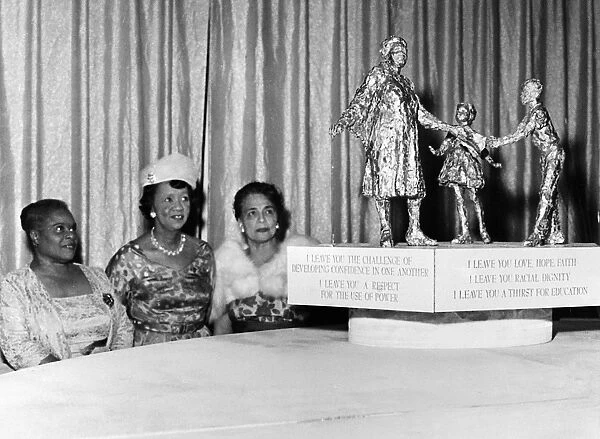 Three women admire a model of the Mary McLeod Bethune Memorial sculpture by Robert Berks. Photograph, c1973