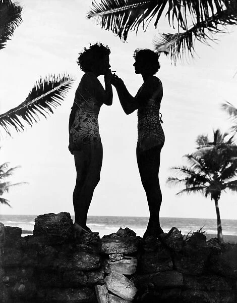 WOMEN, c1944. Two women on the beach. Photograph, c1944