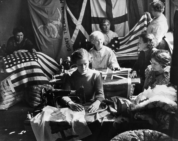 Women employed by the Works Progress Administration sewing American flags in Miami, Florida. Photograph, c1938