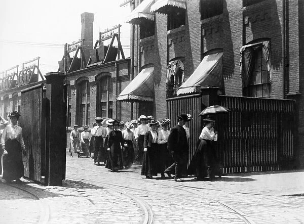 WOMEN FACTORY WORKERS. Women workers leaving a Lynn, Massachusetts, shoe factory for the day