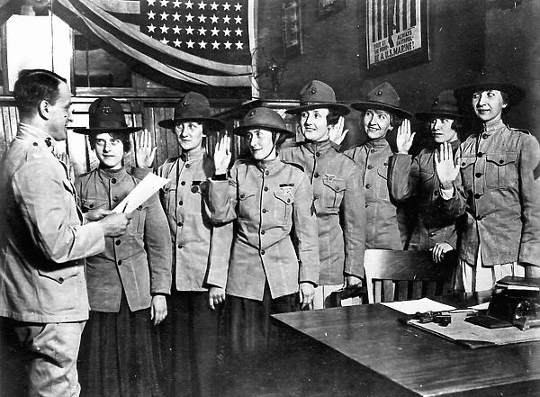 WOMEN MARINES, 1918. Women being sworn in to the United States Marine Corps, where