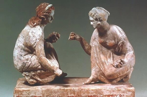 Women playing Knucklebones. Terracotta, South Italian Greek, about 300 BC. Height: 8 inches