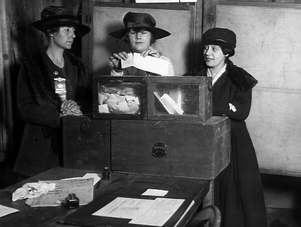 WOMEN VOTING, c1917. Three women casting votes in New York State, c1917