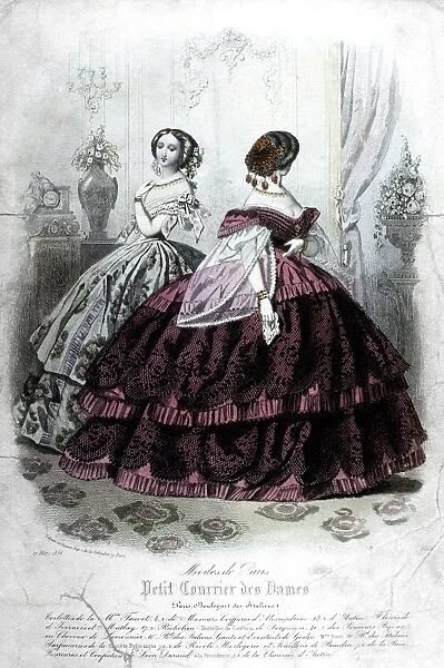 WOMENs FASHION, 1858. Two society women wearing hoop skirt dresses by a Paris designer. French color fashion plate from Petit Courrier des Dames, 1858