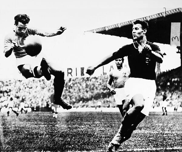WORLD CUP, 1938. Alfredo Foni of Italy kicks the ball during the 1938 World Cup final match against Hungary