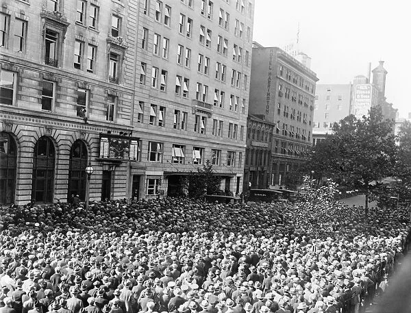 WORLD SERIES, 1925. A crowd of baseball fans watching a scoreboard on a street in Washington, D. C. during the 1925 World Series between the Pittsburgh Pirates and the Washington Senators, October 1925