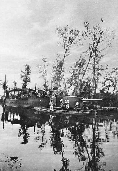 WORLD WAR I: ARMED BARGE. A French barge armed with cannons to deter German advances