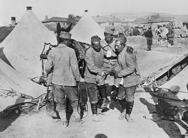 WORLD WAR I: BALKANS. A wounded Serbian soldier being carried into a Red Cross