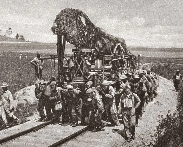 WORLD WAR I: CAMOUFLAGE. A heavy French gun covered in camouflage being transported